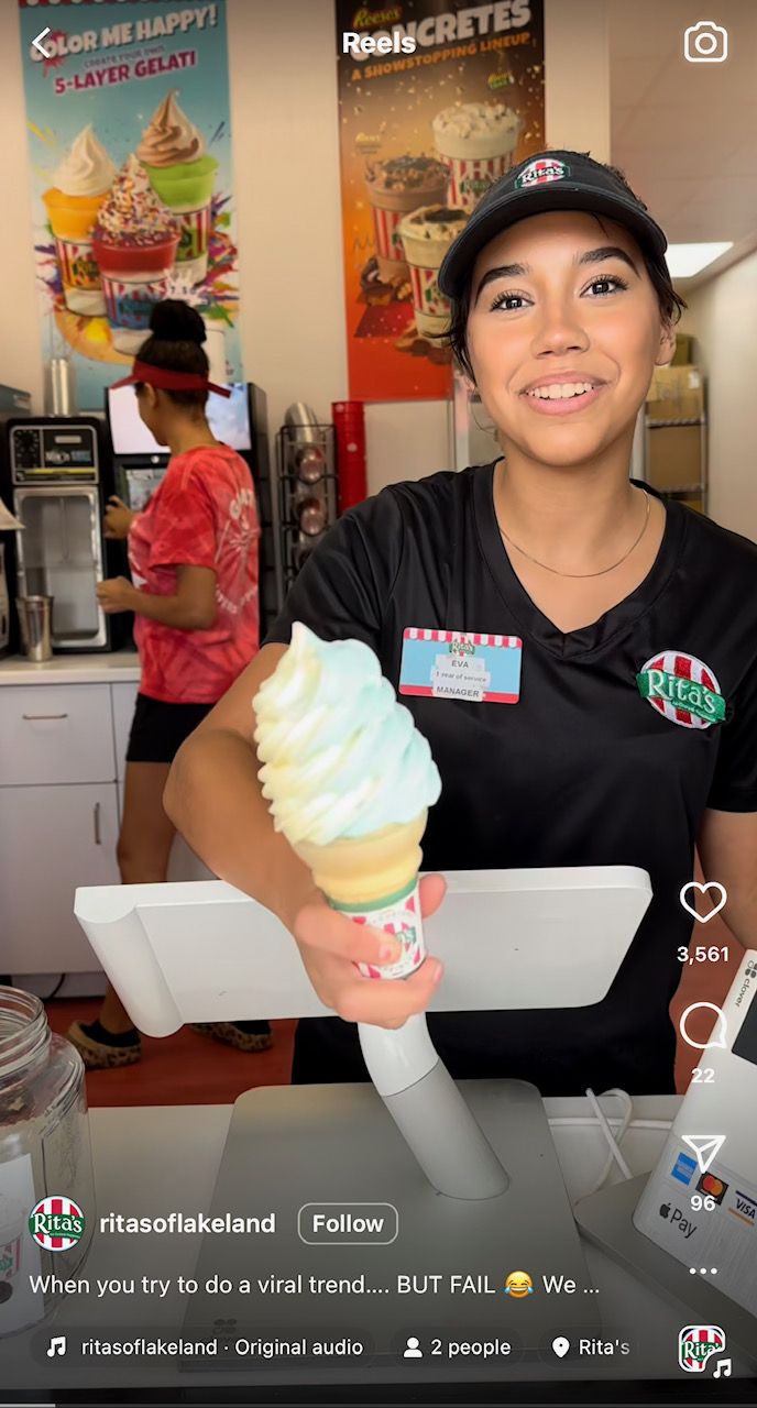 Girl in an Instagram video holding an ice cream cone in a Rita's uniform